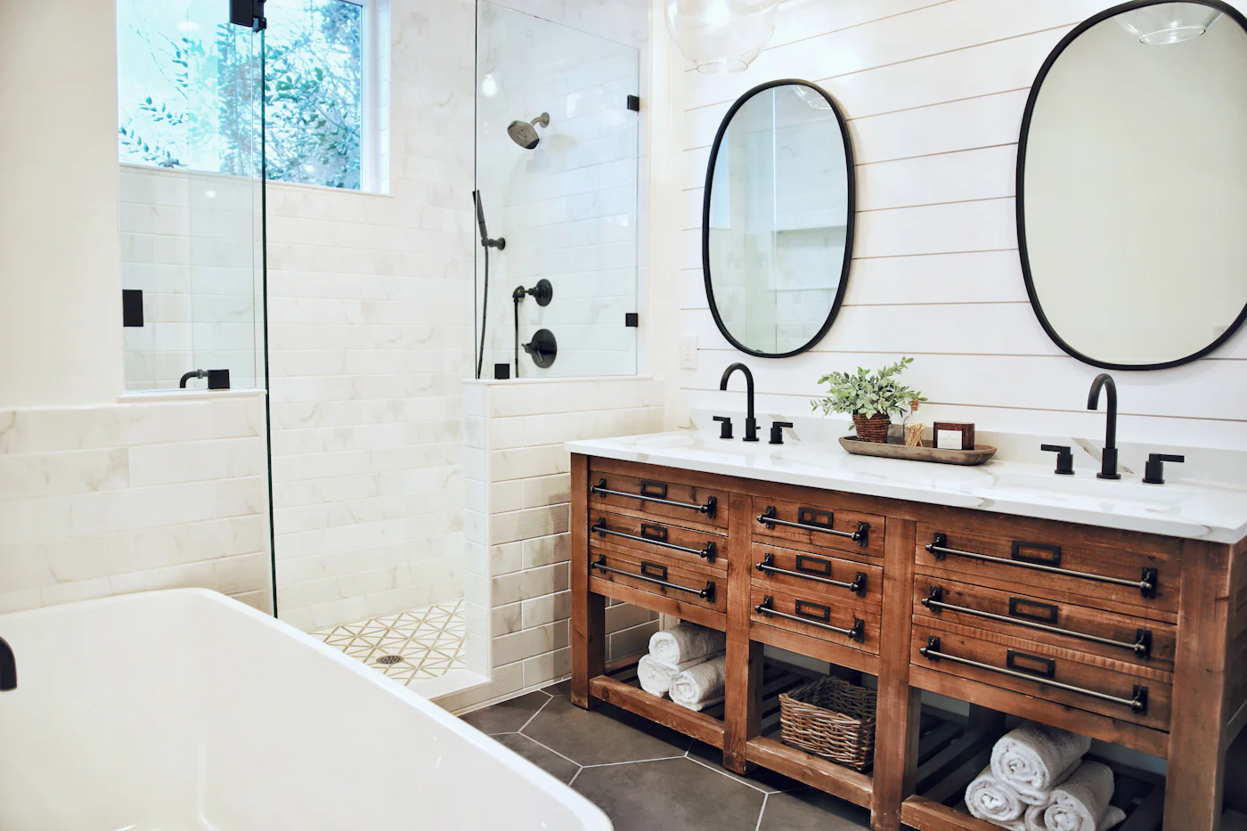 Family bathroom with a white bath and wooden cabinets